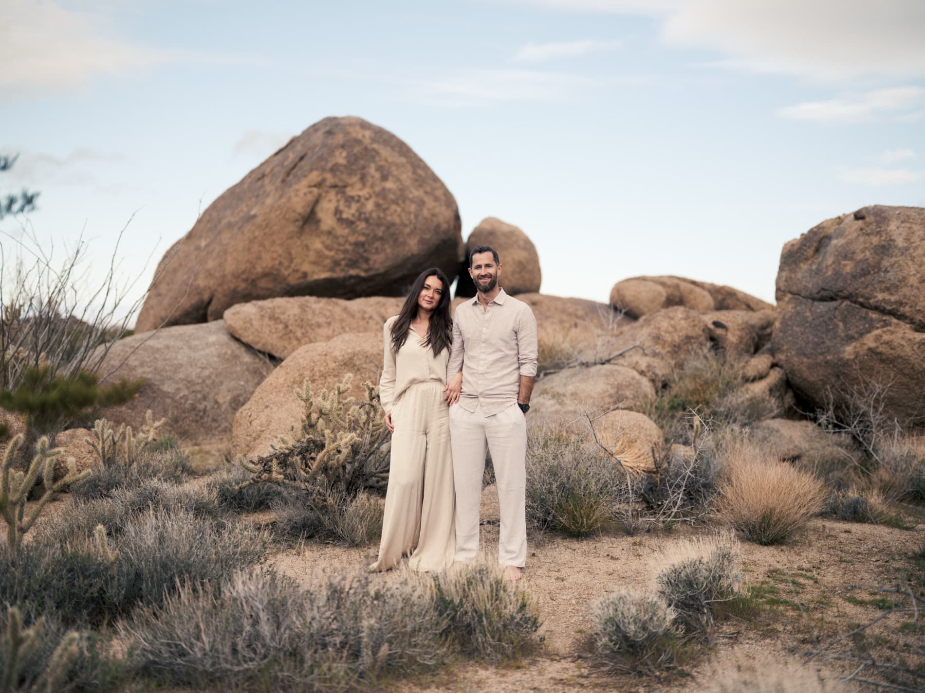 Jared and Annette Thurmon standing together among desert boulders